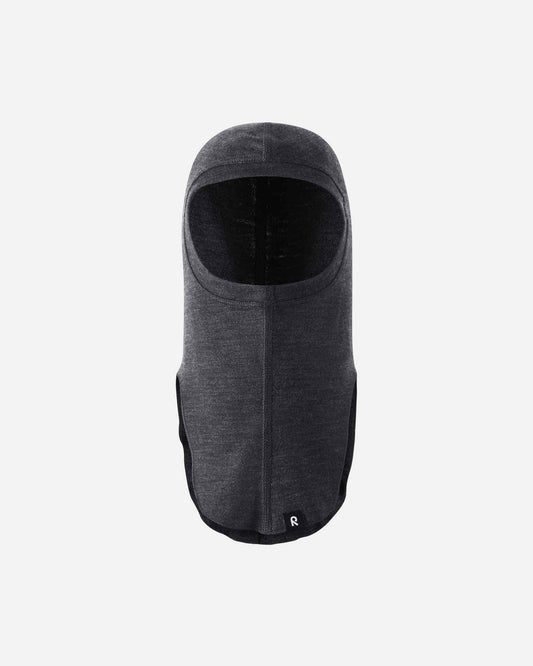 Front flat lay view of the black melange Reima Aurora kids' wool base layer balaclava, highlighting the full coverage design for the head, neck, and upper chest to protect against cold winter drafts.