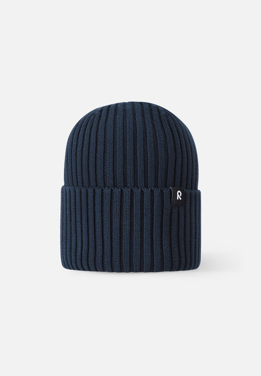 Front view of the Reima Hattara kids' organic cotton ribbed beanie in classic navy blue, featuring a stylish folded cuff and a subtle black Reima logo tag.