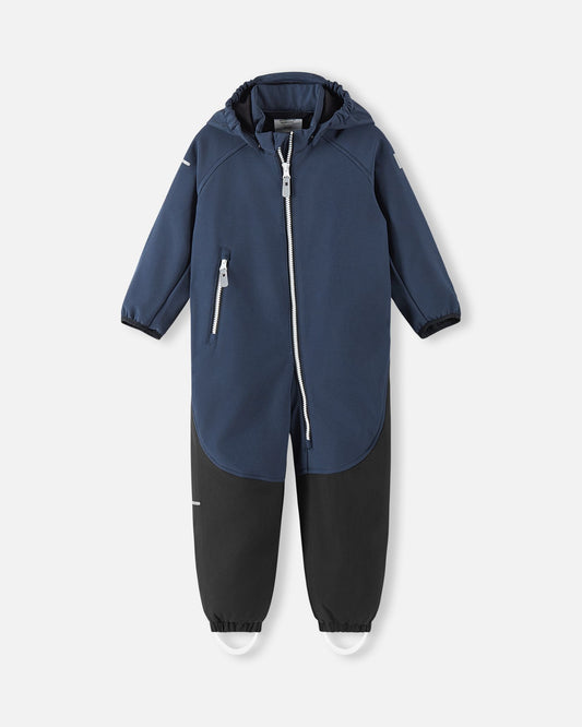 Front view of the Reima Mjosa kids' waterproof softshell coverall in navy blue and black, featuring a full-length zipper, a detachable hood, and durable reinforced wear-resistant lower legs for active outdoor play.