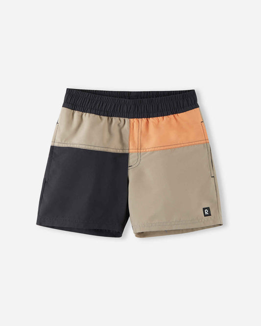 Front view of the Reima Palmu kids' UPF 50+ sunproof swim shorts featuring a stylish soft black, beige, and orange color block design, crafted with quick-drying fabric for active beach and pool days.