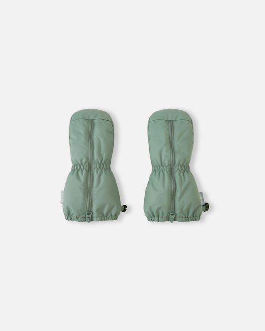 Front view of a pair of stone green Reima Tassuin woven toddler mittens, featuring full-length top zippers for easy dressing and elastic gathered wrists to keep snow out during winter play.