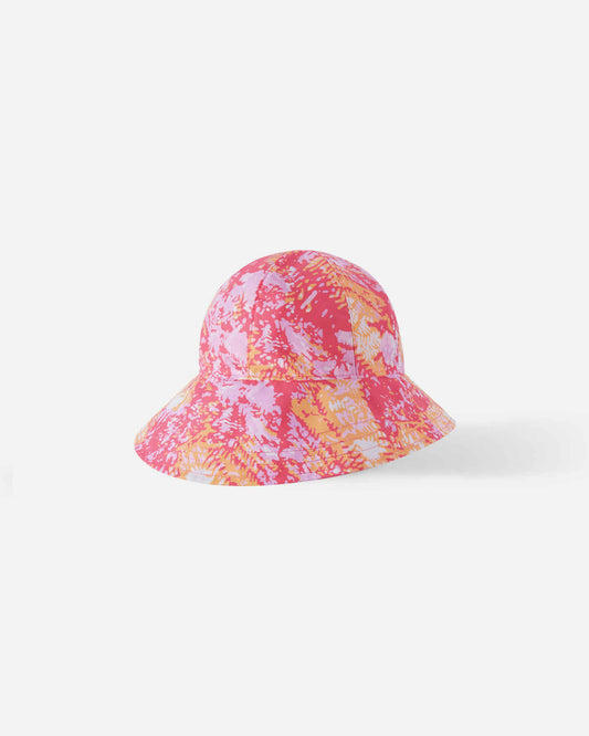 Front view of the Reima Viiri kids' UPF 50+ sunproof bucket hat in soft coral, featuring a bright pink and orange abstract tie-dye pattern and a protective wide brim for hot summer days on the beach.