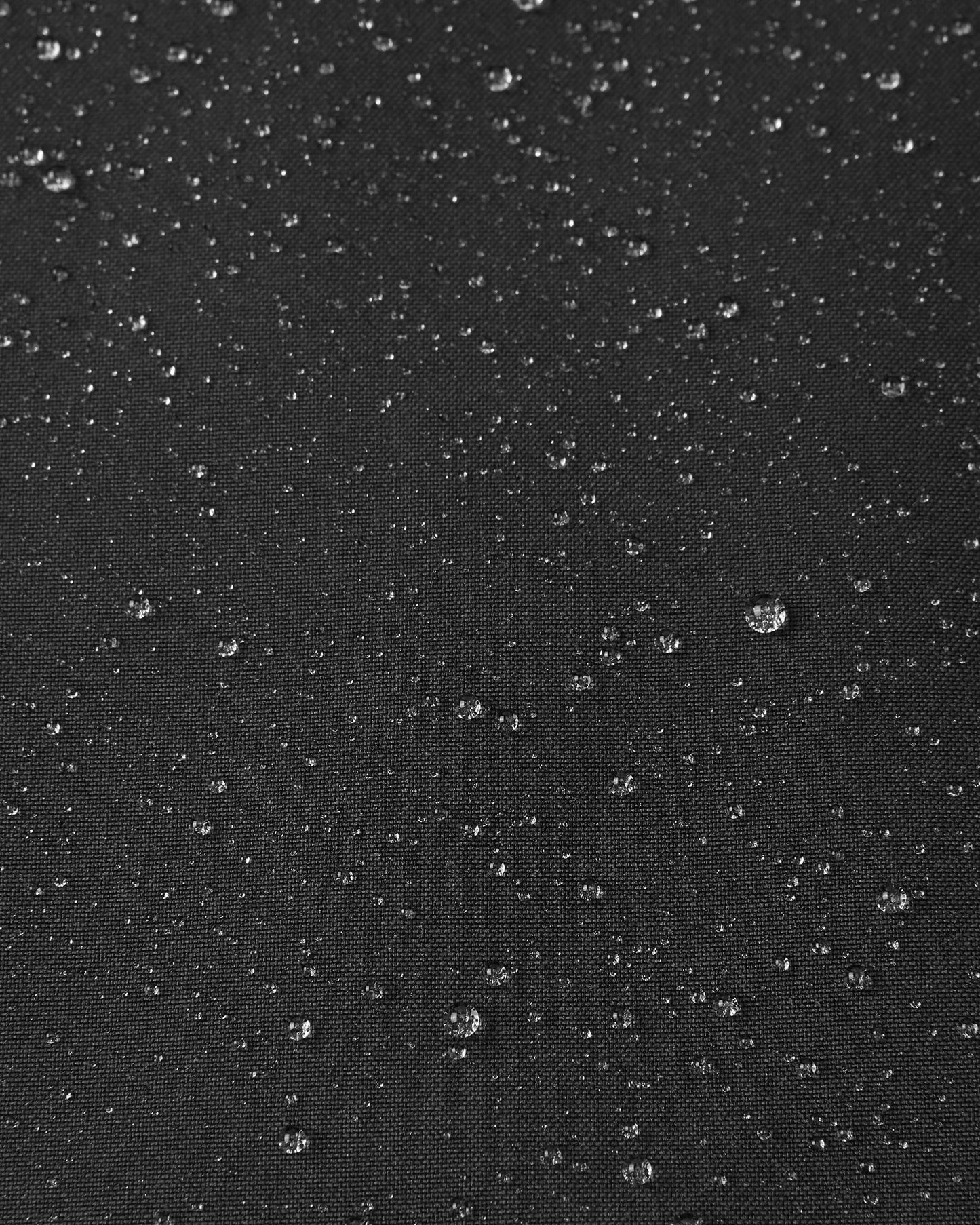 Detail of the durable, breathable, and water-repellent fabric on the Sulkava kids' shell.