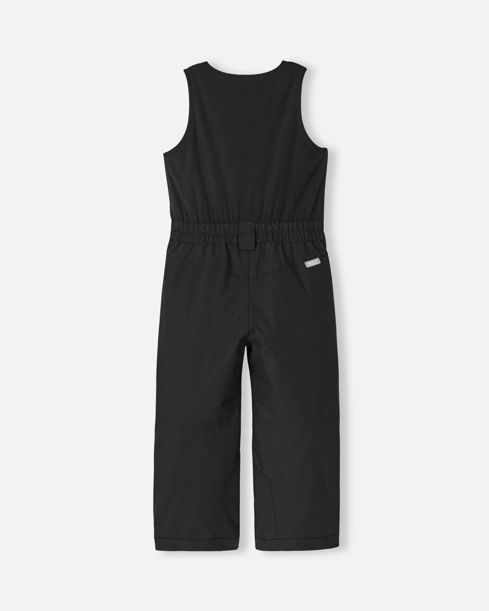 Back flat lay view of the all-black Reima Alppi kids' ski bib pants, displaying the comfortable elastic waist panel and the durable waterproof fabric engineered for sledding, skiing, and snowboarding.