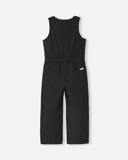 Back flat lay view of the all-black Reima Alppi kids' ski bib pants, displaying the comfortable elastic waist panel and the durable waterproof fabric engineered for sledding, skiing, and snowboarding.