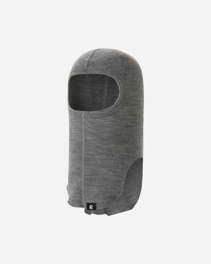 Angled front view of the melange grey Reima Aurora kids' wool base layer balaclava, featuring a smooth, stretchy face opening for comfortable, gap-free protection against harsh winter winds.