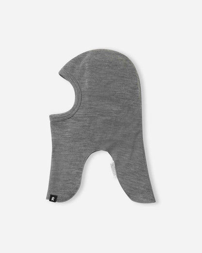Side profile view of the melange grey Reima Aurora kids' wool balaclava, detailing the streamlined, form-fitting silhouette that effortlessly layers under heavy winter beanies or alpine ski helmets.