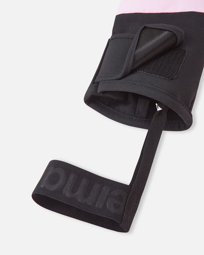 Close-up of the Reima Hankas kids winter glove cuff, showing the adjustable hook-and-loop velcro strap and the integrated elastic wrist leash designed for secure wear.
