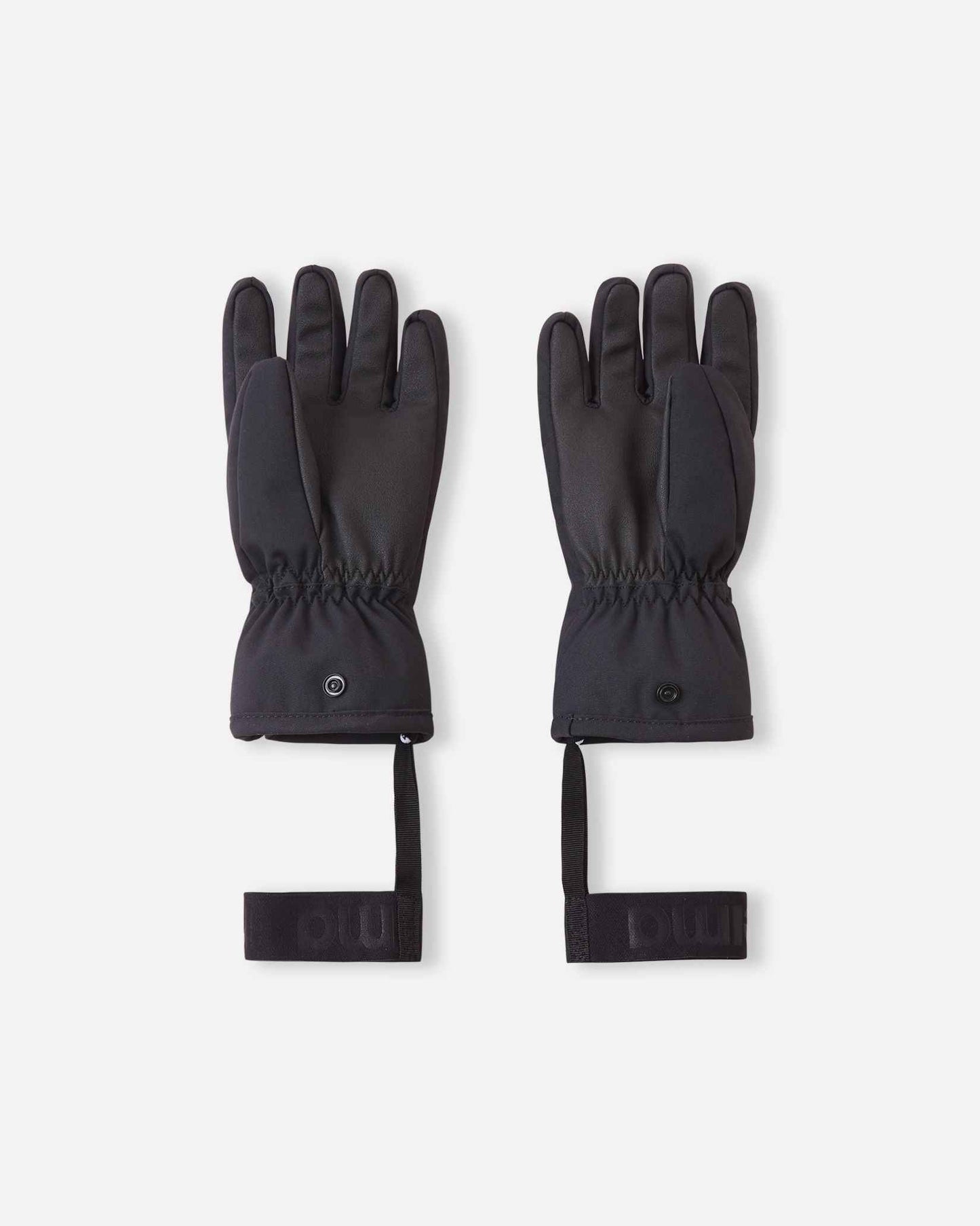 Flat lay view of the palms of the soft coral Reima Hanskas kids' ski gloves, showcasing the durable black reinforced gripping surface on the fingers and palms designed for securely holding ski poles during winter sports.