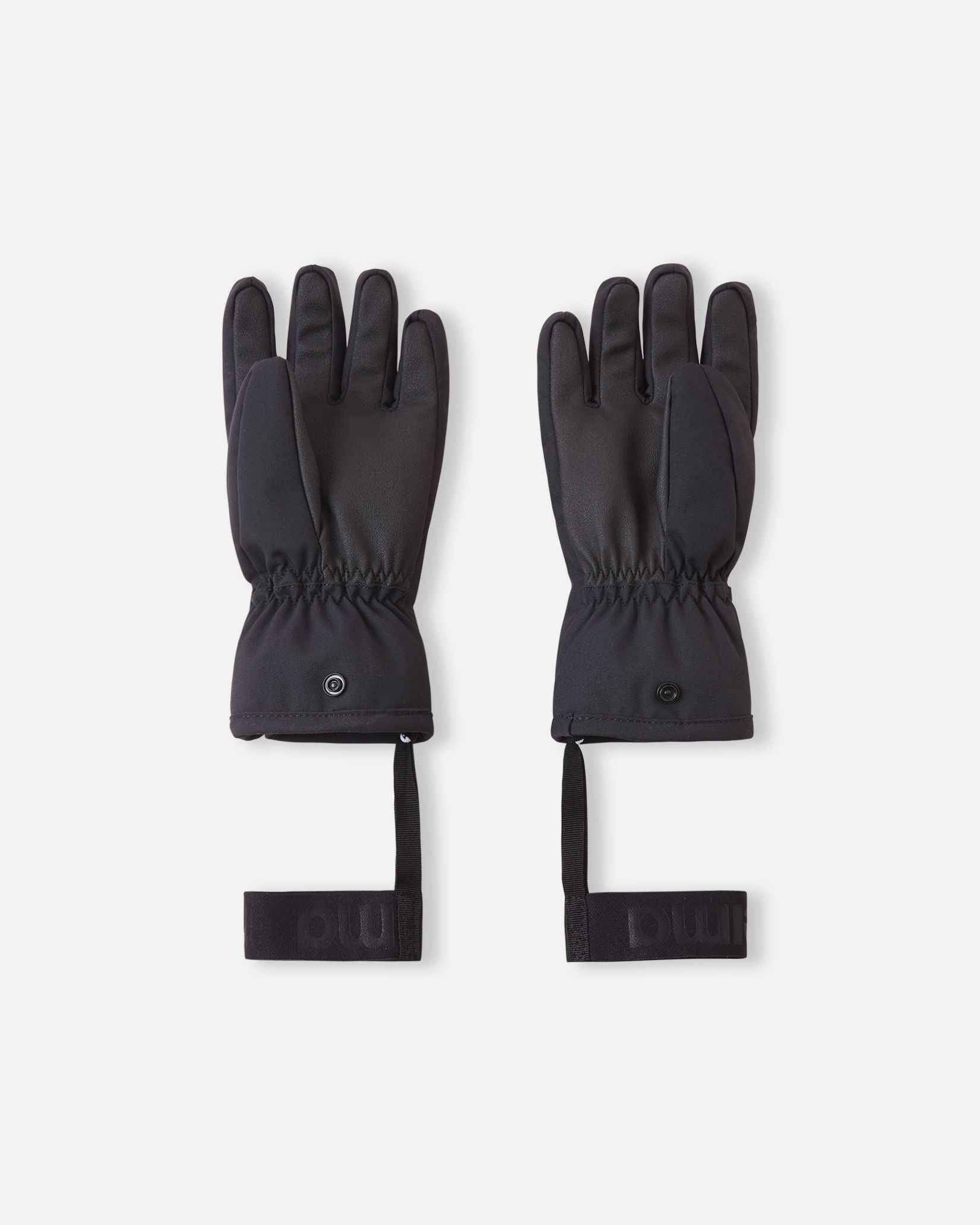 Flat lay view of the palms of the soft coral Reima Hanskas kids' ski gloves, showcasing the durable black reinforced gripping surface on the fingers and palms designed for securely holding ski poles during winter sports.