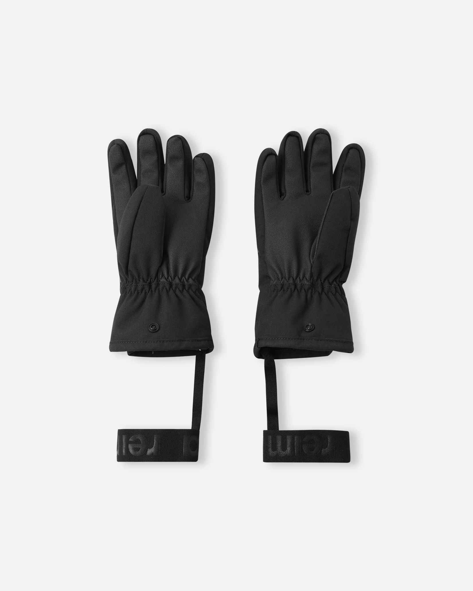 Flat lay view of the palms of the twilight blue Reima Hanskas kids' ski gloves, showcasing the highly durable reinforced gripping surface on the thumbs and palms designed for securely holding ski poles during active winter sports.