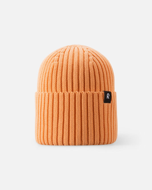 Front view of the Reima Hattara kids' organic cotton ribbed beanie in warm apricot orange, featuring a cozy cuffed brim and a branded Reima label.