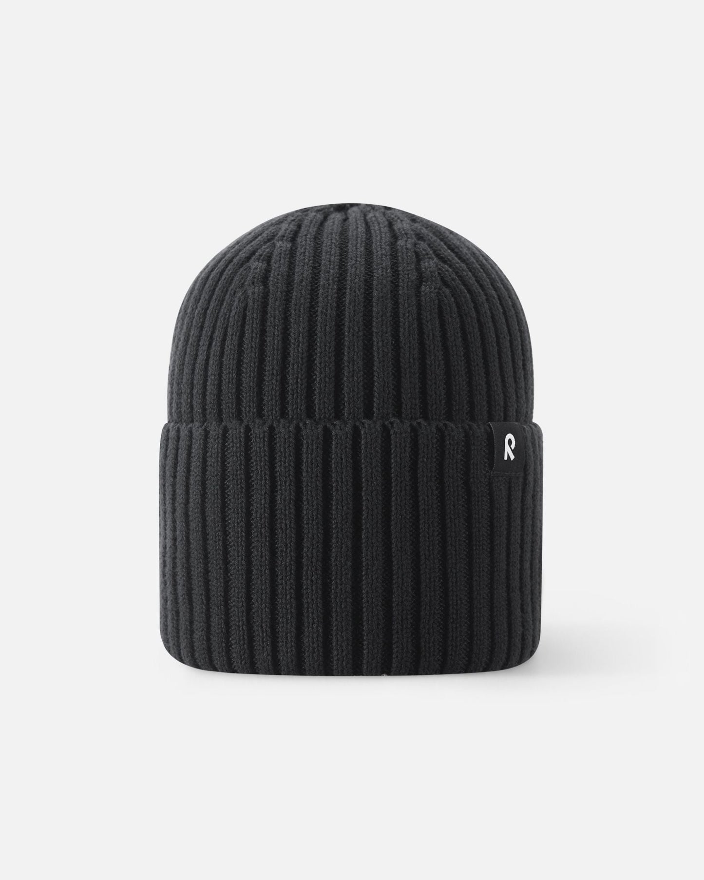 Back view of the Reima Hattara kids' organic cotton ribbed beanie in classic black, showcasing the thick, warm knit texture and cozy cuffed design.