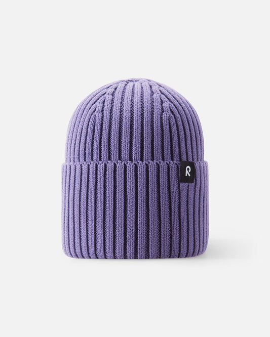 Front view of the Reima Hattara kids' organic cotton ribbed beanie in misty violet, featuring a cozy folded cuff and a branded black-and-white Reima logo tag.