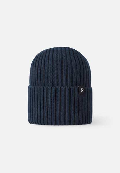 Front view of the Reima Hattara kids' organic cotton ribbed beanie in classic navy blue, featuring a stylish folded cuff and a subtle black Reima logo tag.
