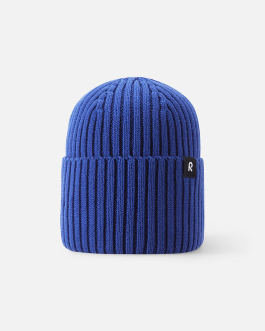 Front view of the Reima Hattara kids' organic cotton ribbed beanie in sparkly blue, featuring a cozy cuffed brim and a black-and-white branded Reima logo tag.