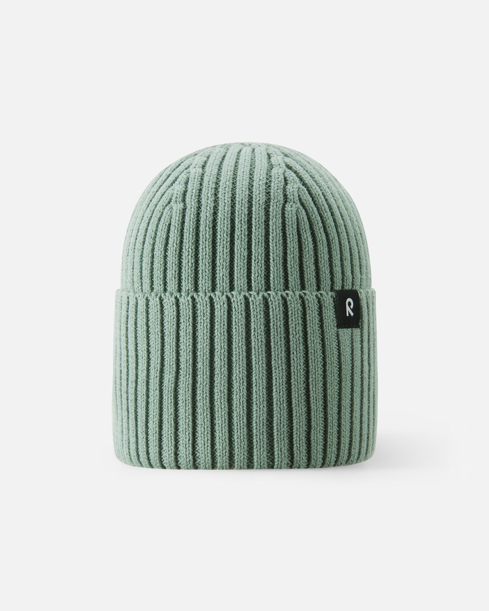 Front view of the Reima Hattara kids' organic cotton ribbed beanie in stone green, featuring a stylish folded brim and a branded black Reima logo tag.