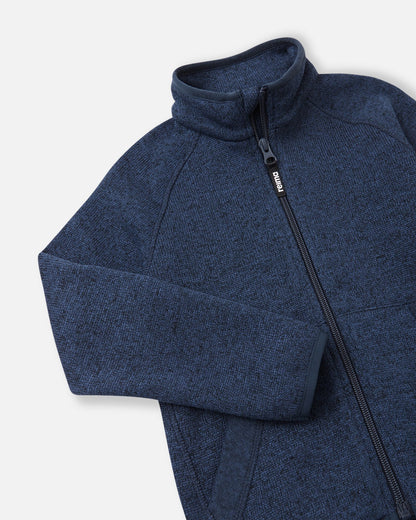 Close-up of the high collar and full-length zipper on the jeans blue Reima Hopper kids' fleece jacket, highlighting the smooth zipper operation and anti-chafe design.