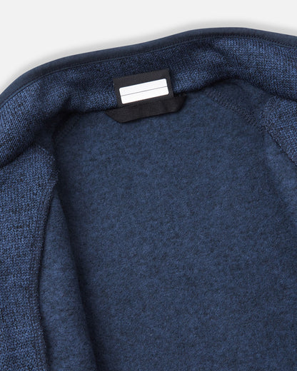 View of the inner neck label and writable name tag on the jeans blue Reima Hopper kids' knit fleece jacket, showcasing the soft brushed fleece interior.