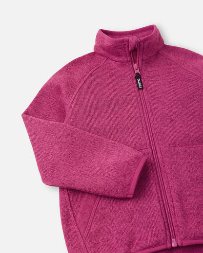 Close-up of the high collar and full-length zipper on the rosy berry Reima Hopper kids' fleece jacket, highlighting the smooth zipper operation and anti-chafe design.