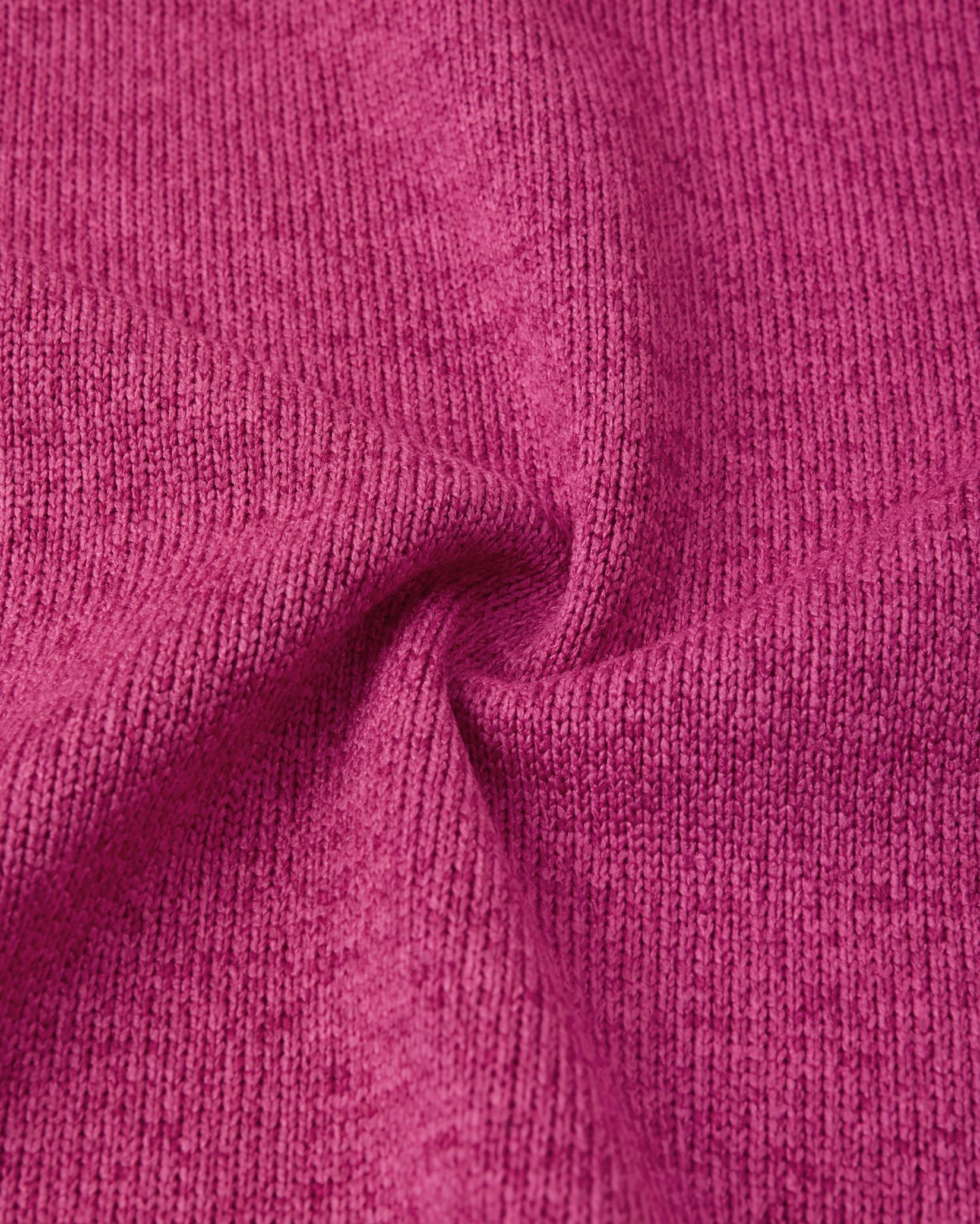 Macro close-up of the Reima Hopper kids' rosy berry knit fleece fabric, demonstrating the high-quality, sweater-like texture and thermal mid-layer performance.