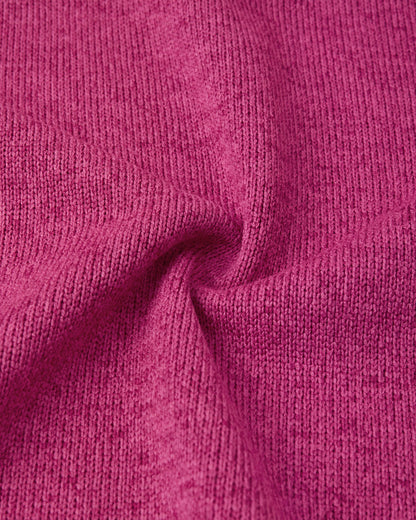 Macro close-up of the Reima Hopper kids' rosy berry knit fleece fabric, demonstrating the high-quality, sweater-like texture and thermal mid-layer performance.