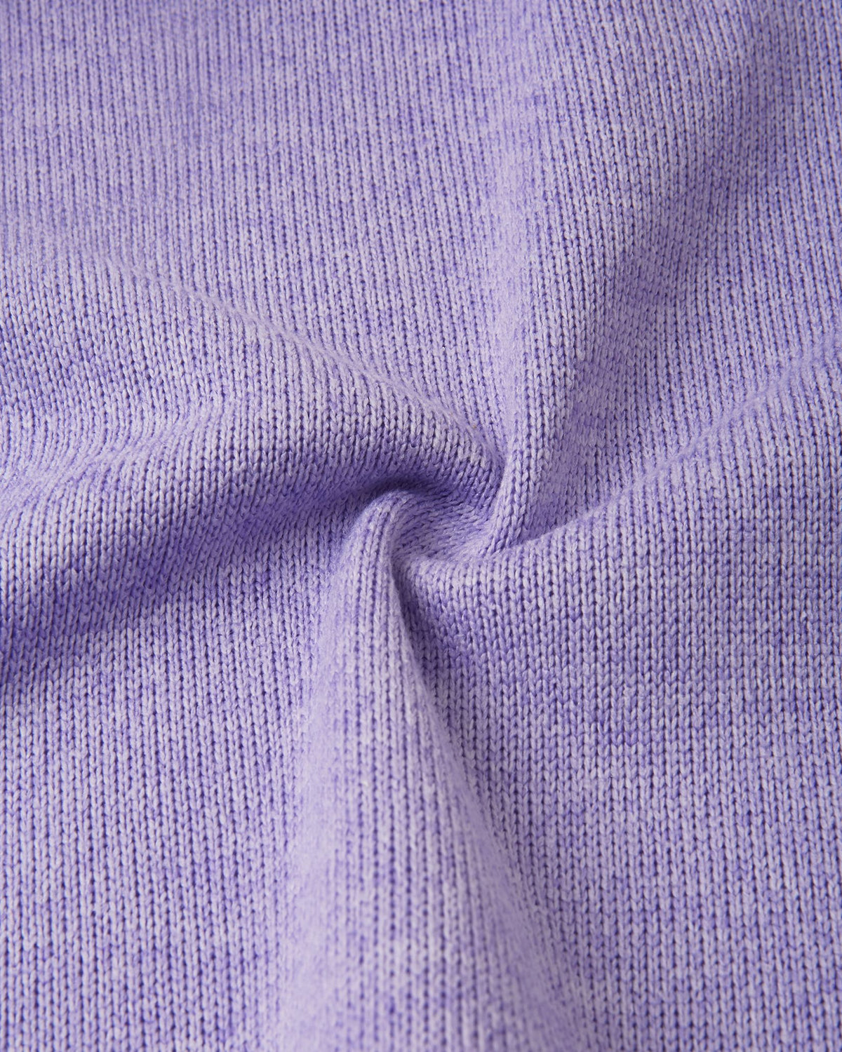 Macro close-up of the Reima Hopper kids' blooming lilac knit fleece fabric, demonstrating the high-quality, sweater-like texture and thermal mid-layer performance.