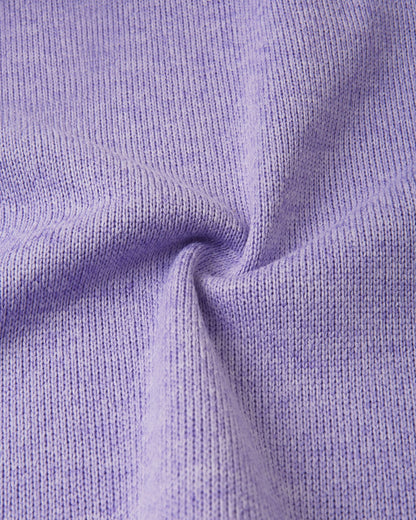 Macro close-up of the Reima Hopper kids' blooming lilac knit fleece fabric, demonstrating the high-quality, sweater-like texture and thermal mid-layer performance.