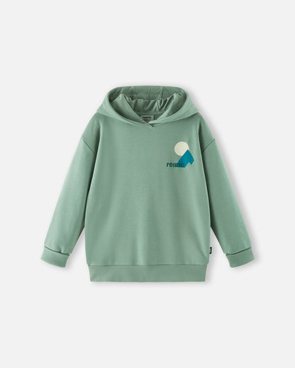 Front view of the Reima Huppis kids' organic cotton pullover hoodie in stone green, showcasing a comfortable everyday silhouette, a soft hood, ribbed hem, and a small chest logo graphic.