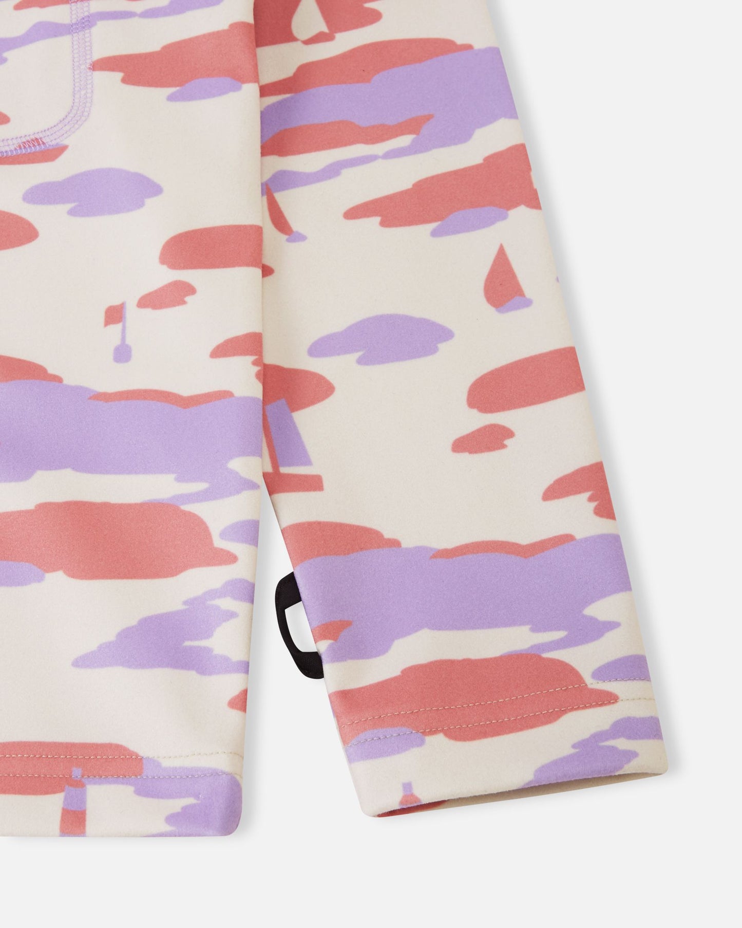 Detailed close-up of the sleeve on the rose blush Reima Iisisti kids' fleece, focusing on the clean hem finish and the subtle Reima branding loop tag at the cuff.