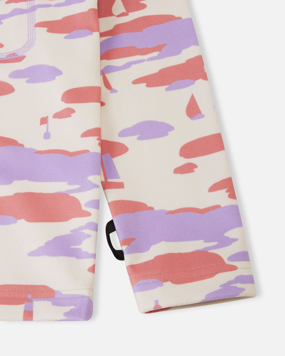 Detailed close-up of the sleeve on the rose blush Reima Iisisti kids' fleece, focusing on the clean hem finish and the subtle Reima branding loop tag at the cuff.
