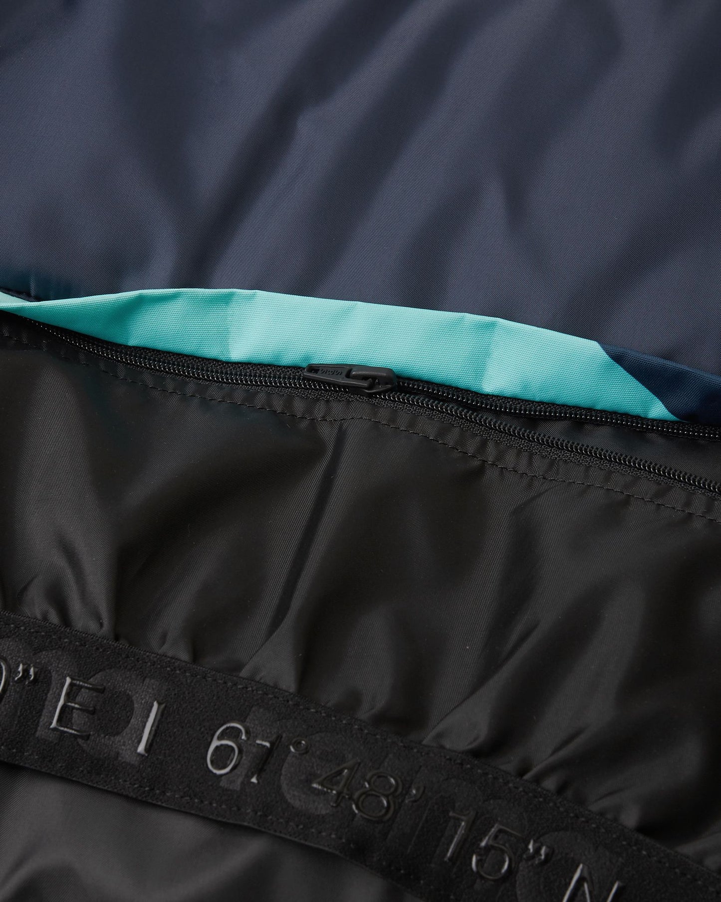 Close-up of the internal elastic snow gaiter and branded grip band inside the bright blue Reima Kairala children's winter outerwear, essential for sealing out powder during active play.