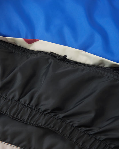 Interior detail of the Reima Kairala kids' ski jacket, showing the internal black zipper mechanism that allows the waist snow lock powder skirt to be completely detached from the inner lining.