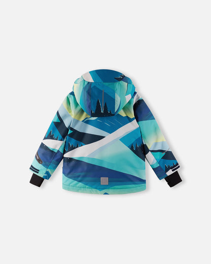 Back view of the bright blue Reima Kairala kids' waterproof ski jacket, displaying the continuous mountain landscape print, a protective hood, and a reflective safety patch at the lower back hem.