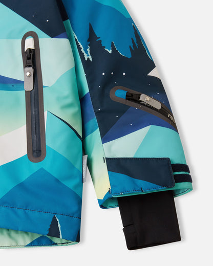 Close-up of the lower sleeve on the bright blue Reima Kairala kids' ski jacket, highlighting the waterproof zippered ski pass pocket, adjustable velcro cuff, and inner lycra thumbhole cuff.
