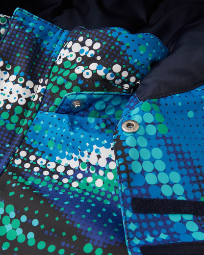 Close-up detail of the protective chin guard and secure collar snap buttons on the twilight blue Reima Kairala kids' waterproof ski jacket, highlighting the durable hardware and digital dot print.