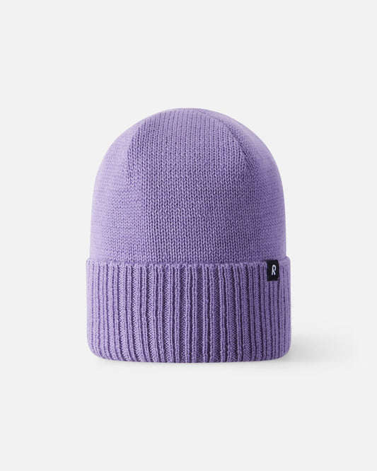 Front view of the Reima Kalotti girls' winter hat in blooming lilac, showcasing the premium merino wool knit and classic ribbed fold-over brim.