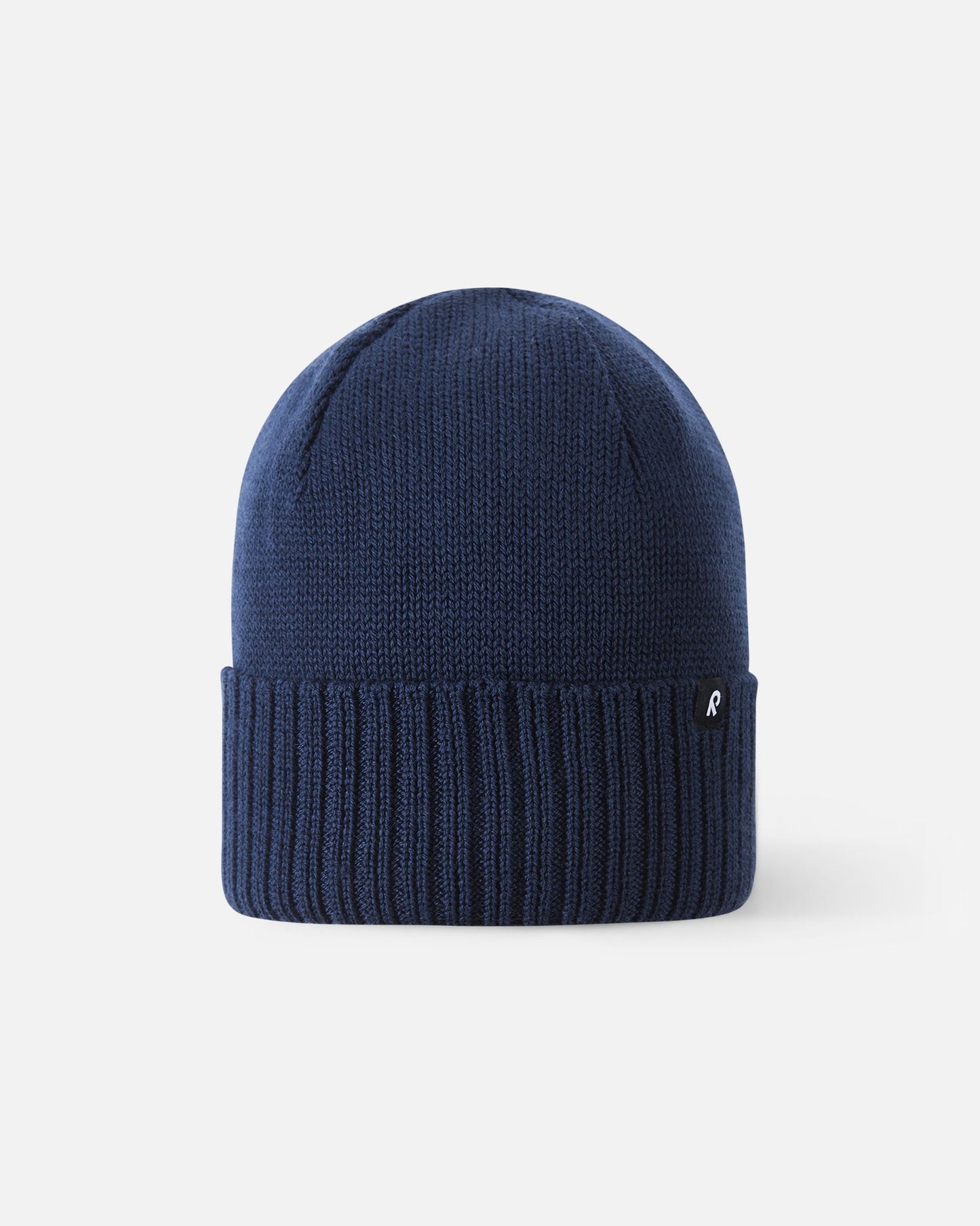 Front view of the Reima Kalotti kids' merino wool beanie hat in classic navy blue, featuring a ribbed fold-over brim.