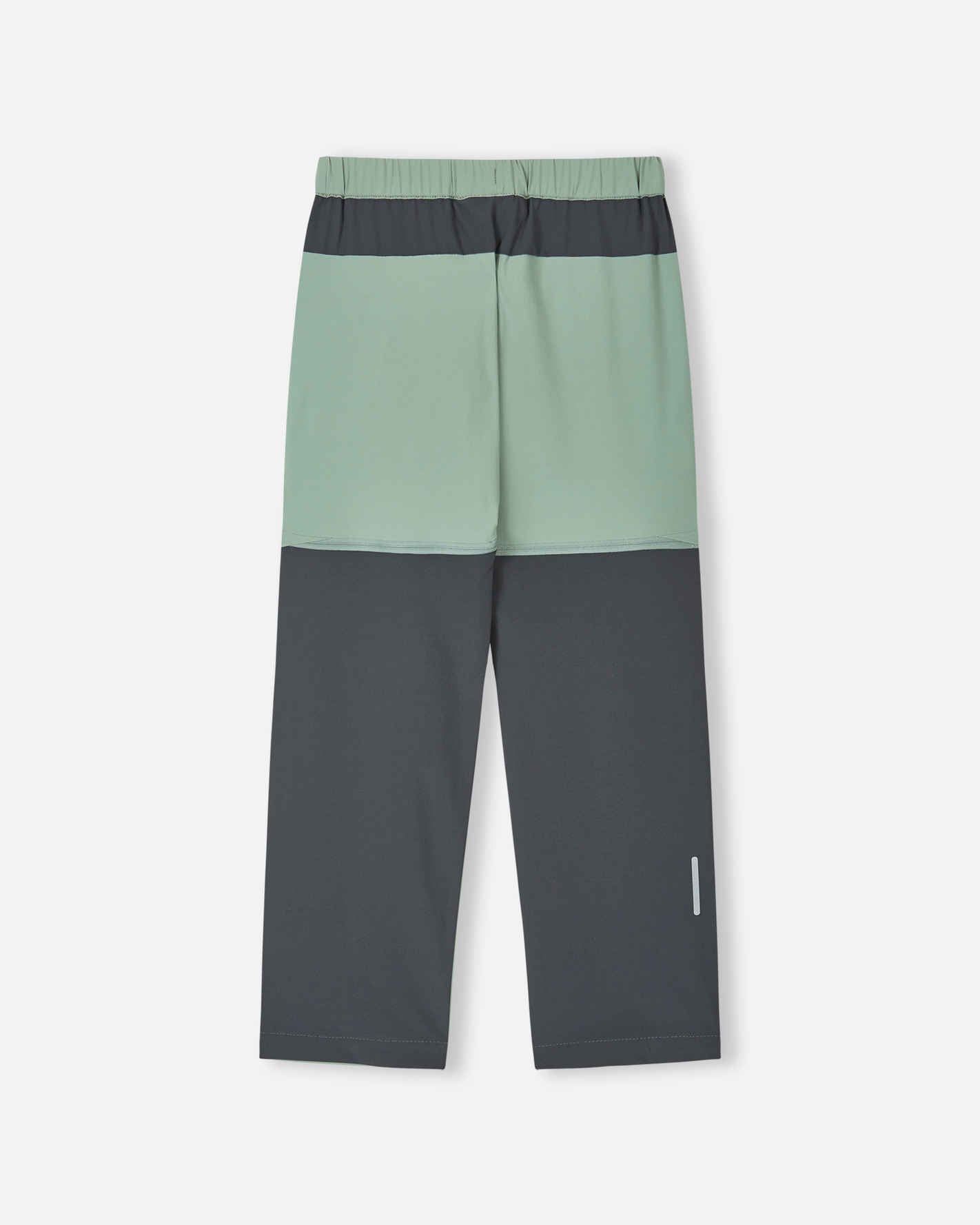 Back view of the stone green Reima Kaveris kids' hiking pants, showcasing the dark grey reinforced seat, reflective safety detail on the lower leg, and durable stretch fabric for outdoor adventures.
