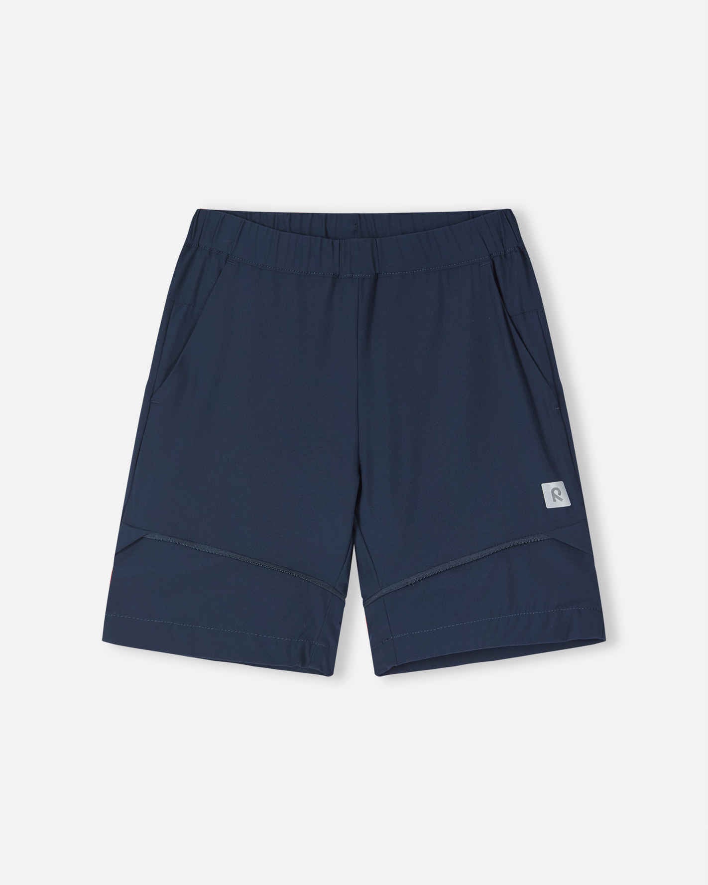 Front view of the Reima Kaveris kids' hiking pants converted into navy blue shorts, highlighting the versatile zip-off design, relaxed fit, and practical side pockets for warm weather hiking.