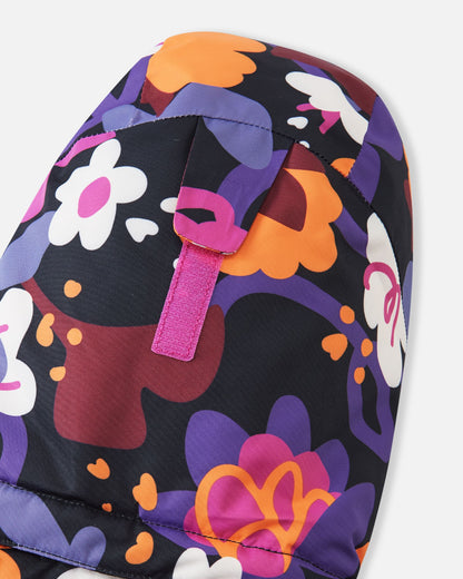 Close-up of the back of the hood on the Reima Kiiruna girls' ski jacket, featuring a Velcro adjustment tab designed to customize the fit, depth, and peripheral vision over a ski helmet or beanie.