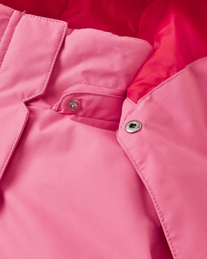 Detailed close-up of the tear-away metallic safety snaps connecting the hood to the collar of the solid soft coral Reima Kiiruna girls' winter coat, ensuring a quick release if snagged during active play.