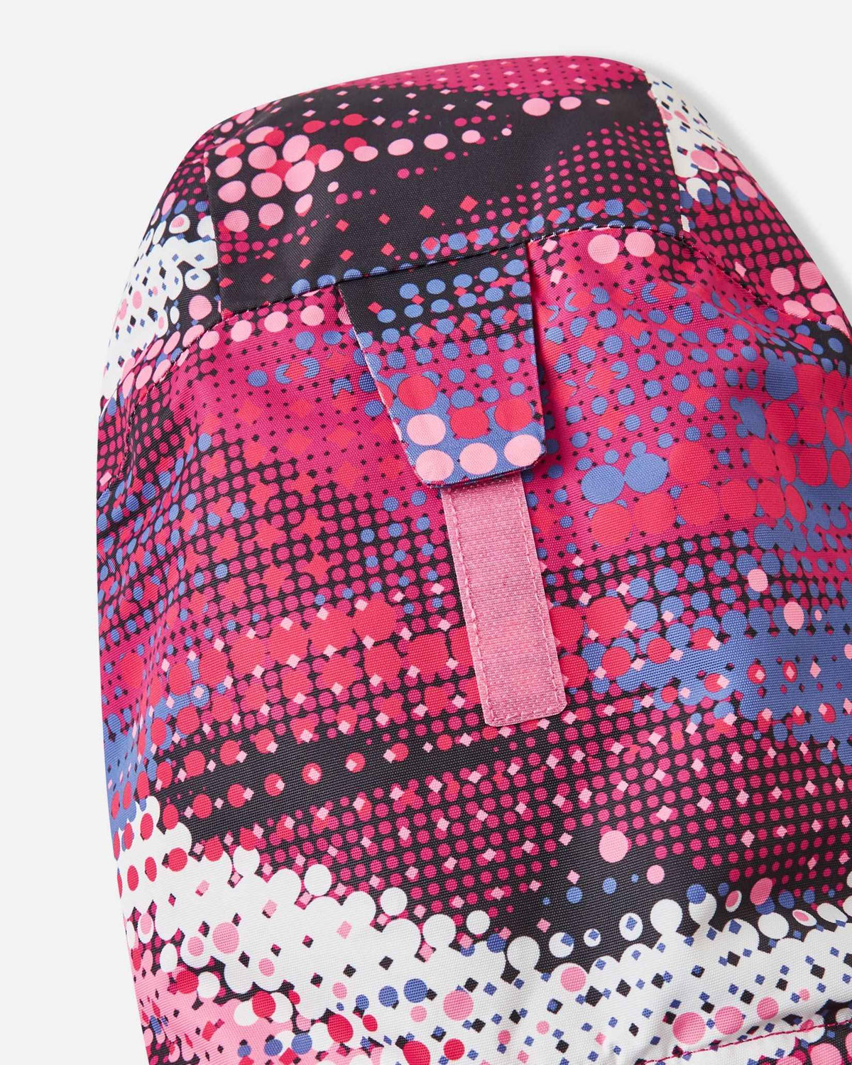 Close-up of the rear hook-and-loop velcro tab on the rosy berry Reima Kiiruna ski jacket hood, designed for quick volume adjustment over a child's winter beanie or ski helmet.