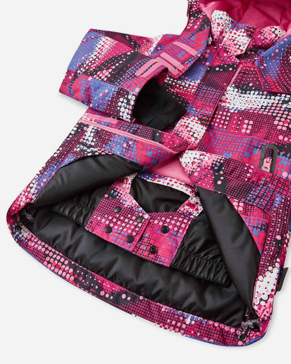 Open interior view of the lower hem on the rosy berry patterned Reima Kiiruna kids' snow coat, revealing the integrated snap-button powder skirt designed to completely seal out deep snow during alpine skiing and winter play.