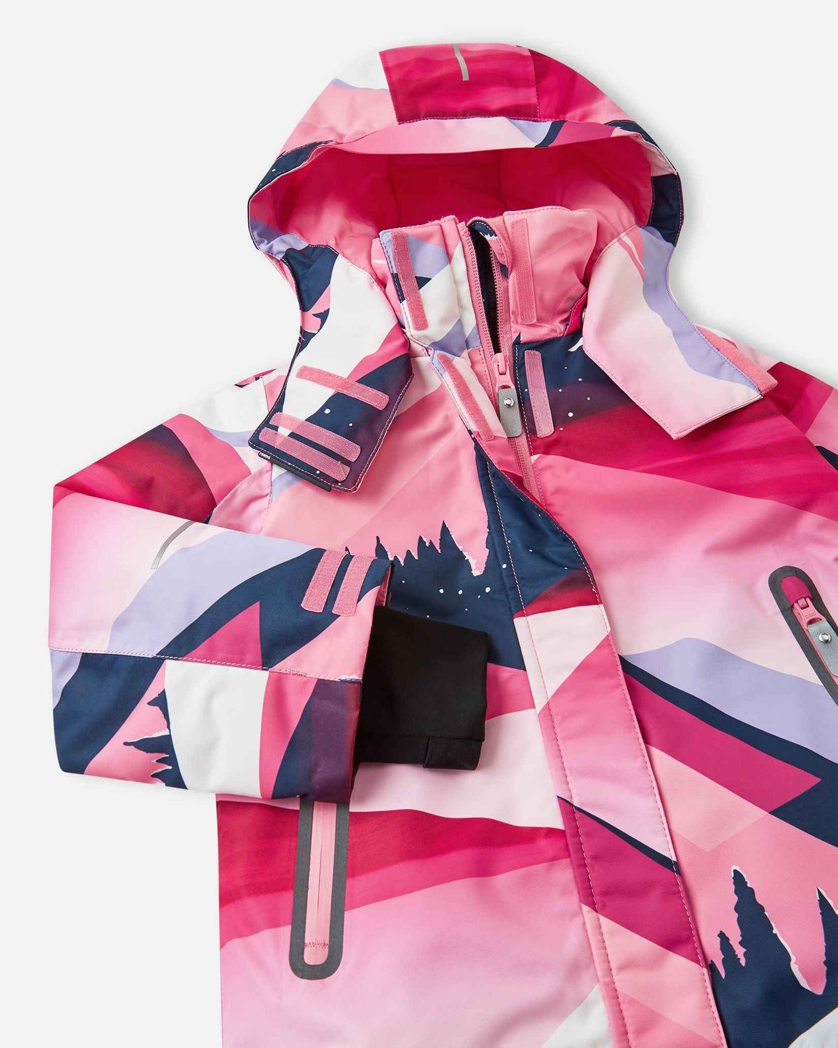 Angled upper-torso detail of the soft coral print Reima Kiiruna kids' snow jacket, showing the tall fleece-lined collar, durable main zipper with a storm flap, and secure hook-and-loop hood attachments.
