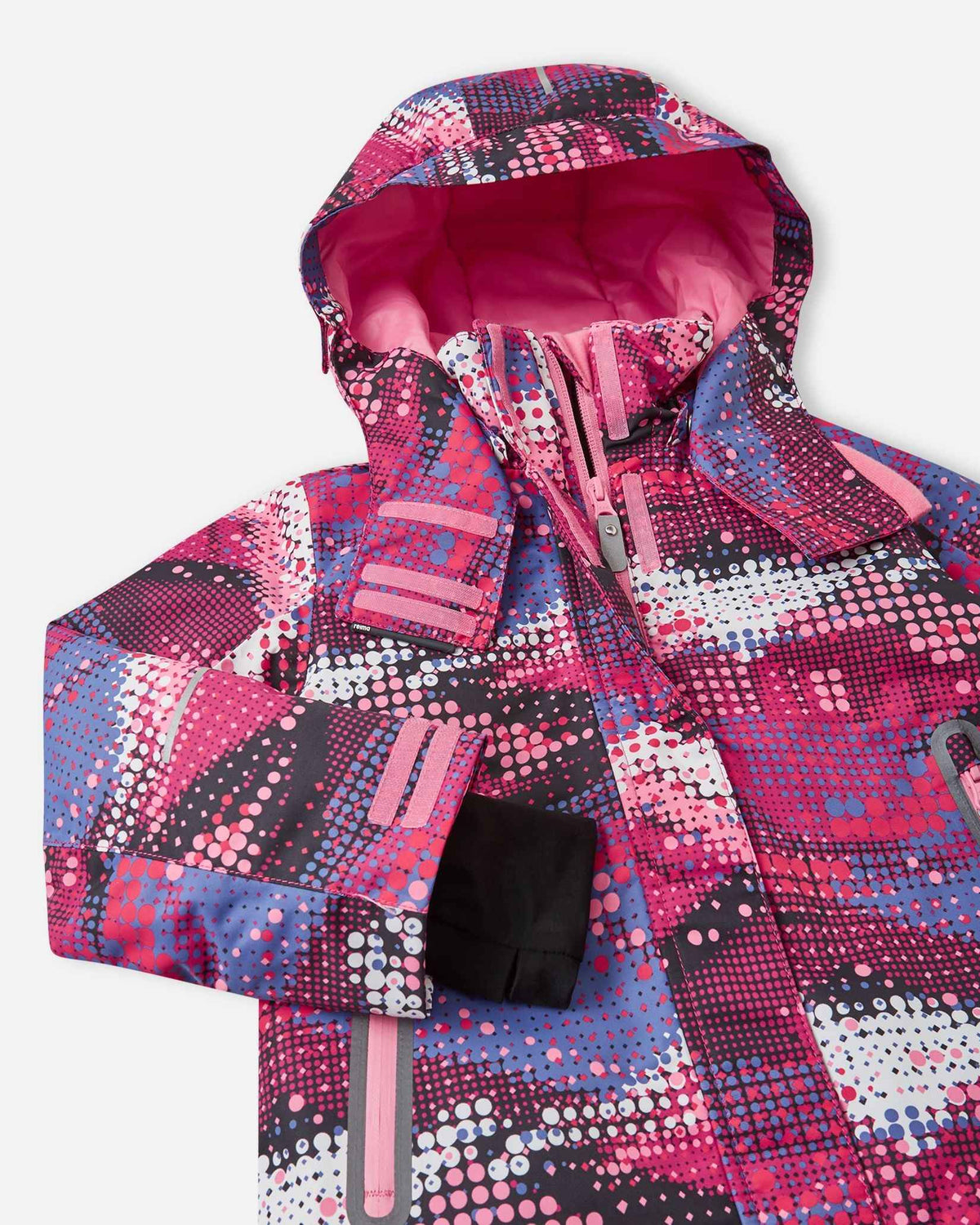 Angled upper-torso detail of the rosy berry print Reima Kiiruna kids' winter jacket, displaying the fleece-lined high collar, protective center storm placket, and hook-and-loop hood fasteners.
