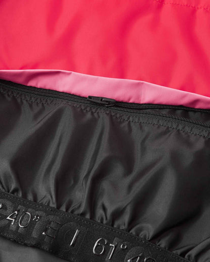 Close-up of the durable interior zipper attachment for the snow lock on the soft coral Reima Kiiruna kids' winter jacket, ensuring a secure, draft-proof seal against freezing wind and powder.