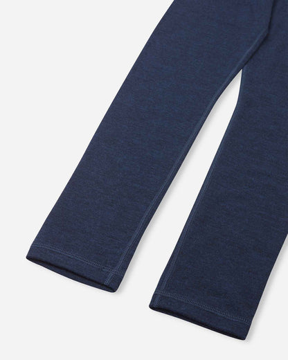 Detailed close-up of the bottom cuffs of the navy blue merino wool base layer leggings from the Reima Kinsei set, showing the precision stitching and fabric texture.