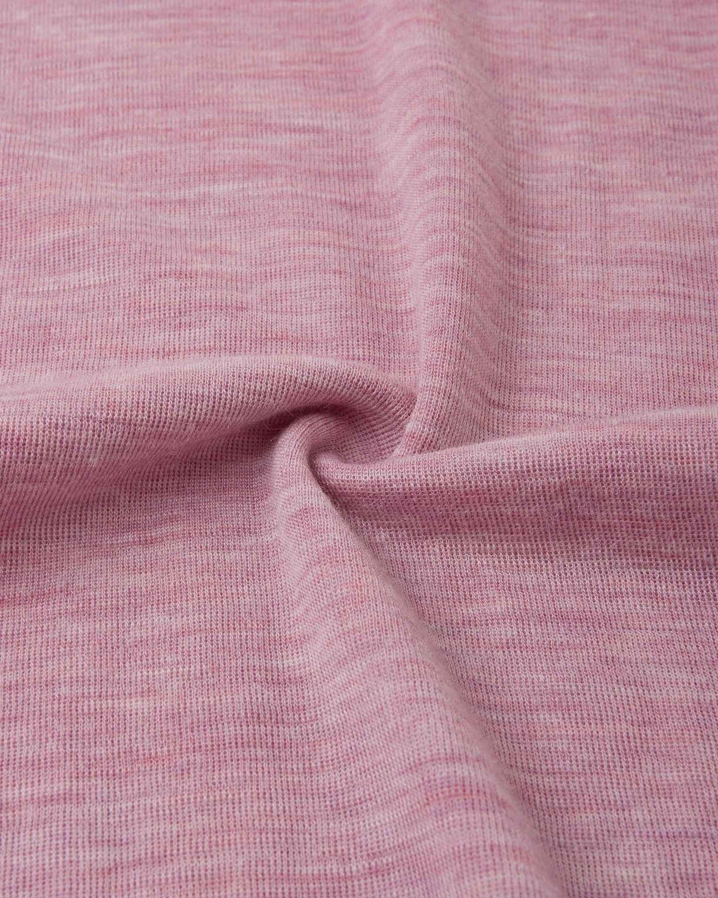 Detailed macro close-up of the grey pink knitted merino wool fabric used in the Reima Kinsei kids' base layer set, swirled to display its soft and warm texture.