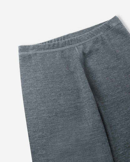Close-up of the comfortable elastic waistband and soft knit fabric on the Reima Kinsei kids' merino wool base layer pants in melange grey.